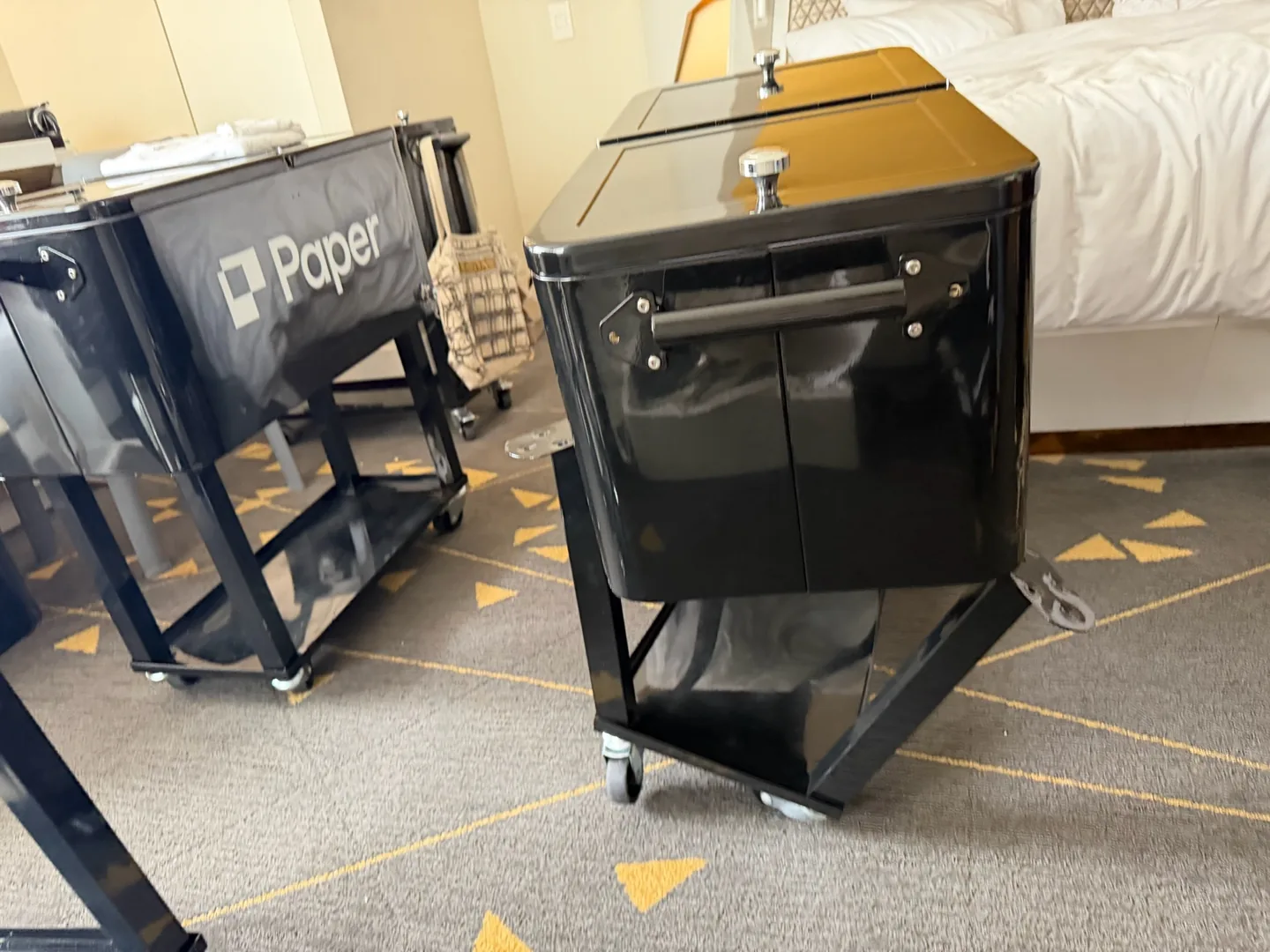 Black Paper coolers on carts