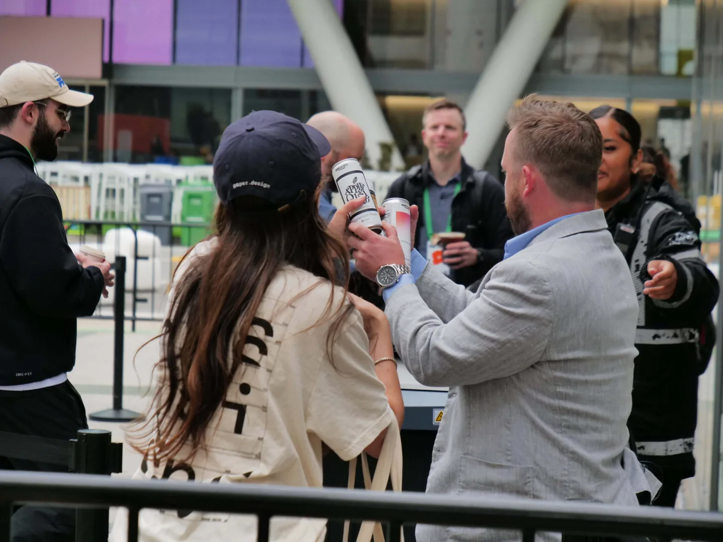 A group outside a building during the can handout