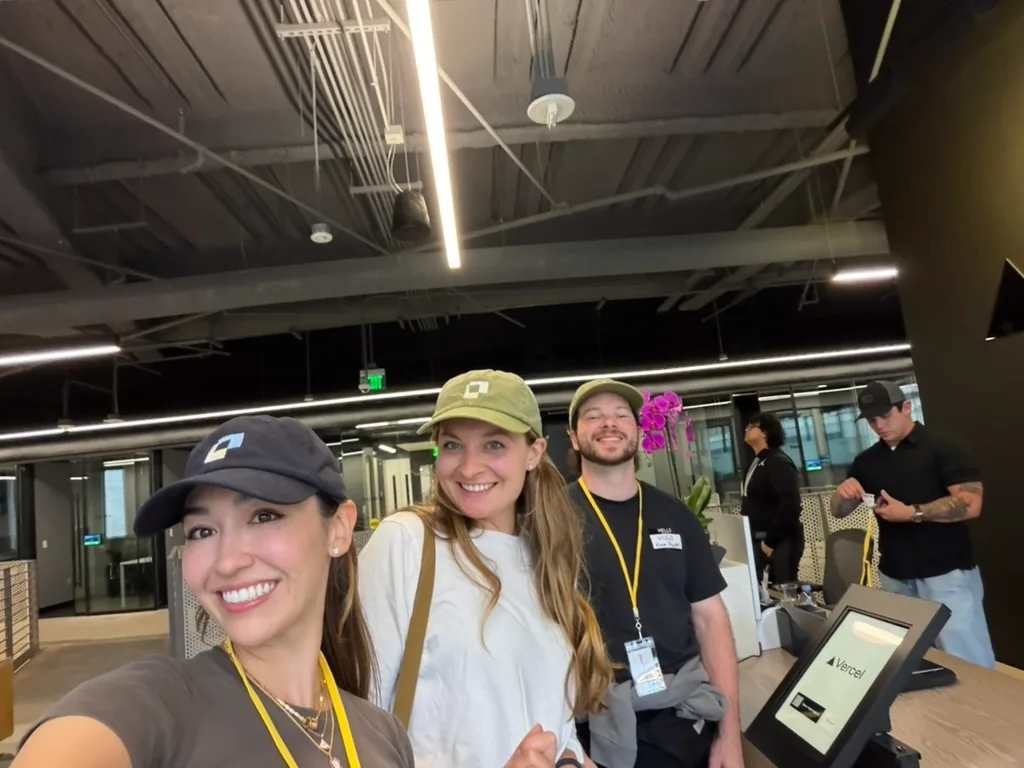 Three people wearing Paper hats in the office