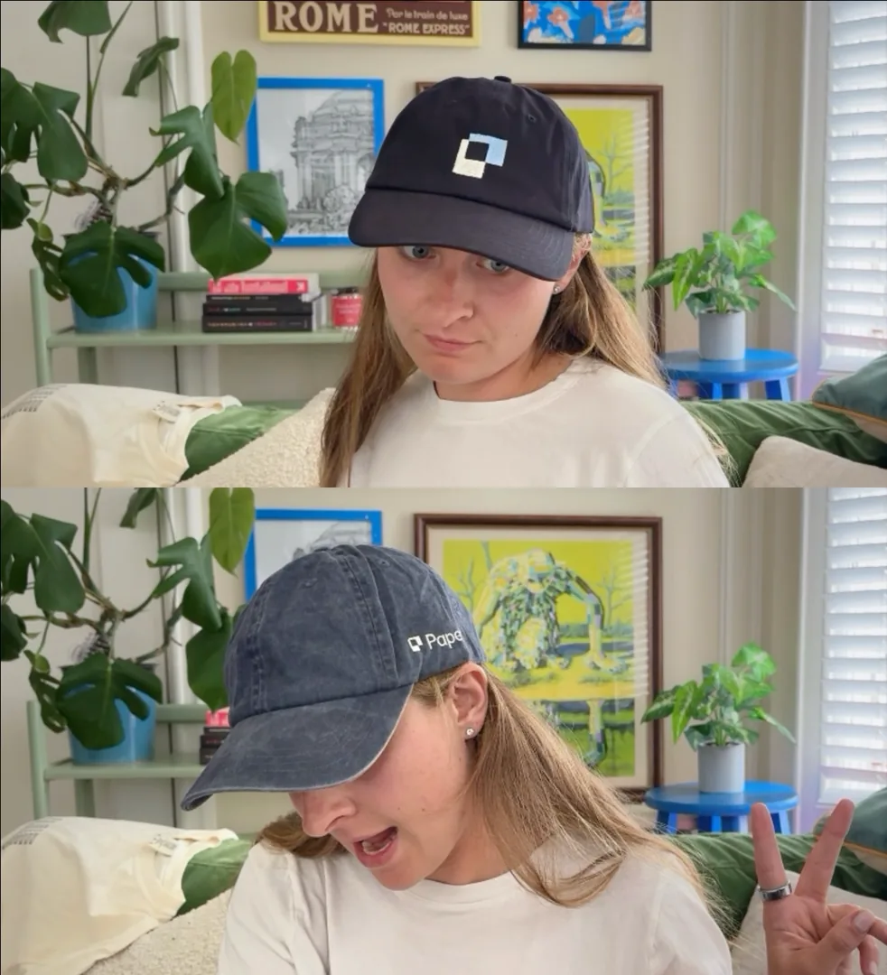 A person wearing a black Paper cap