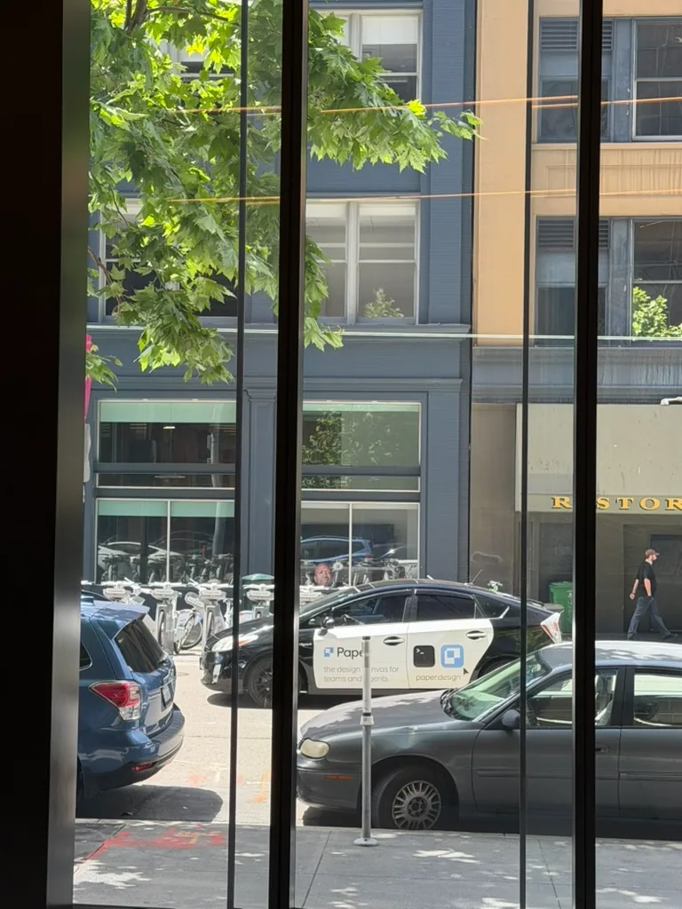 Paper taxis seen through a car window
